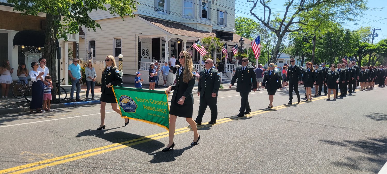 The South Country Ambulance walks down Bellport Lane on Memorial Day.